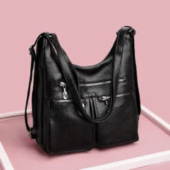 Austin Sac à Main Convertible Sac à Dos 19 Austin Sac à Main Convertible Sac à Dos -Looqita sac convertible Austin noir illustration